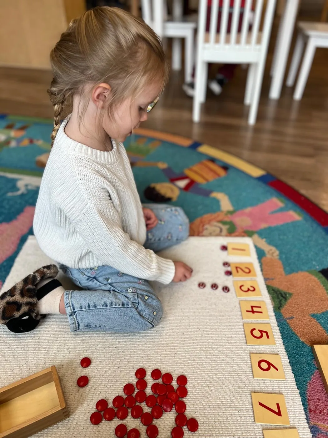 Student working with numbers and counters